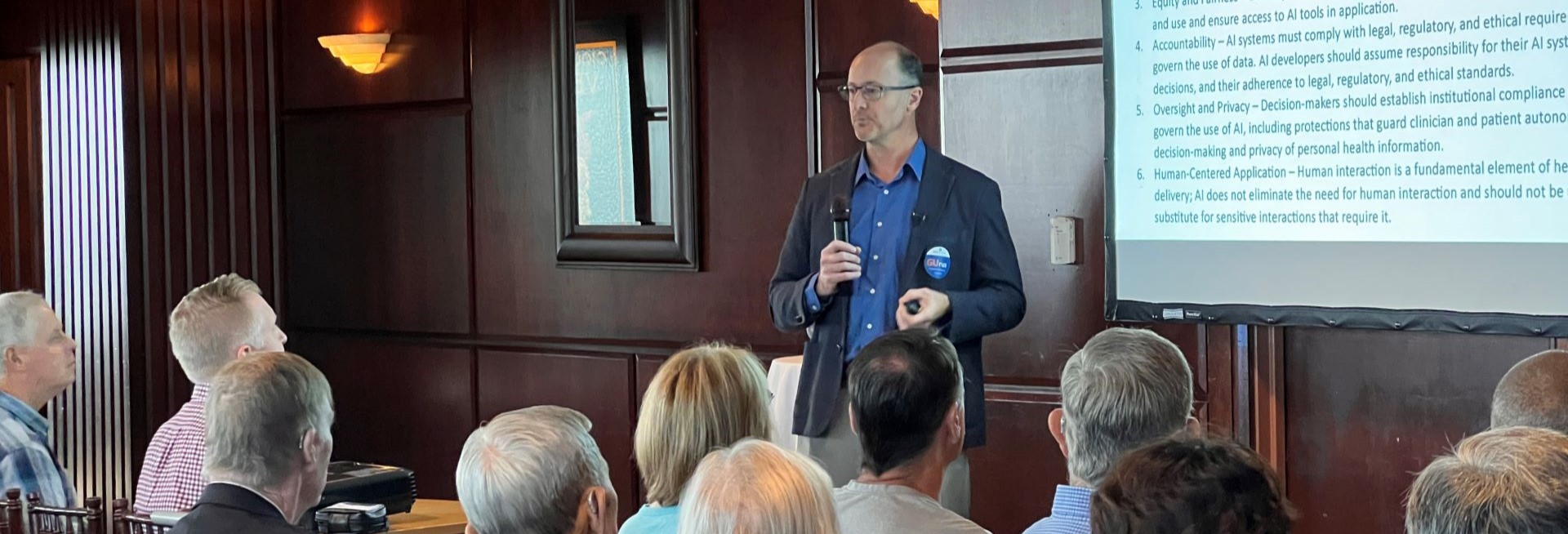 Andrew Armstrong presenting at GU community event