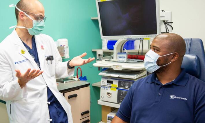 Doctor explains research to patient