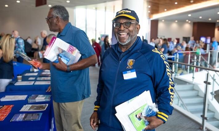 Man smiling at Genitourinary Cancers Community Education Event