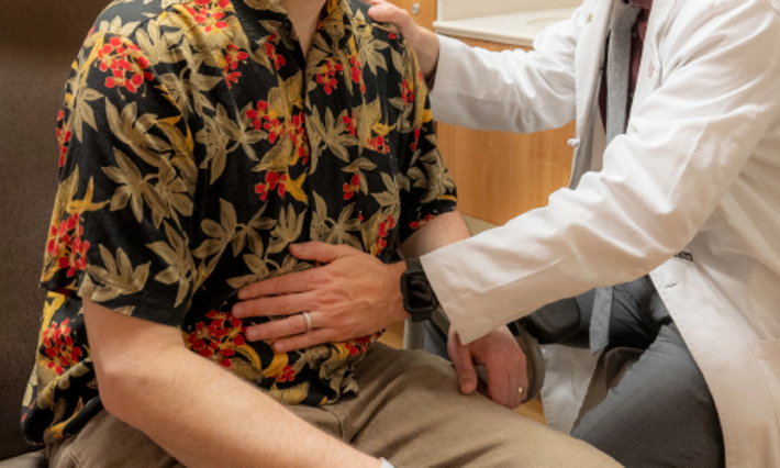 Dr. Devito examining a patient in clinic