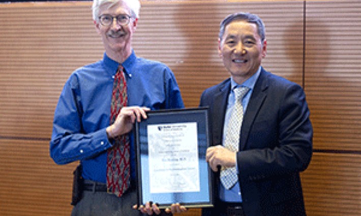 Dr. Rex Bentley (left), Dr. Jiaoti Huang (right)