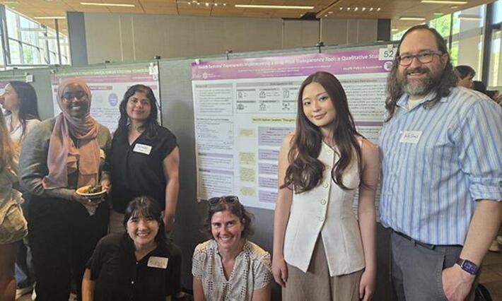 Dr. Caroline Sloan (seated center right) 2026 AMWA Exceptional Mentor, and with her 2026 Bass Connections mentees at April's poster competition.