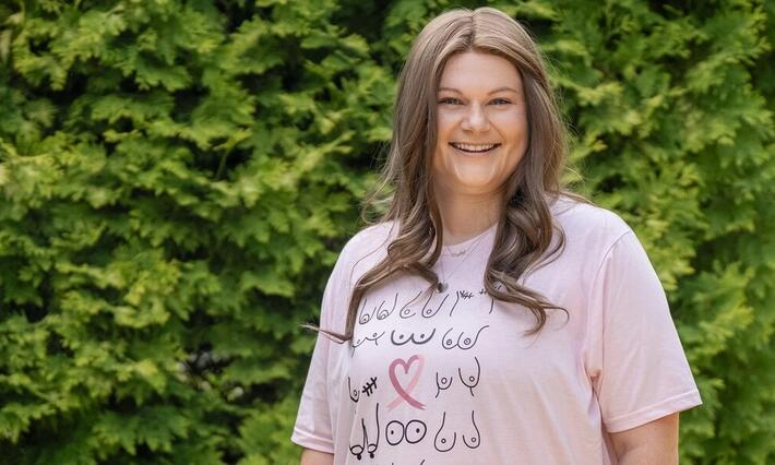 Bailey Geason smiles outside Duke Women's Cancer Care Raleigh after a follow-up appointment.