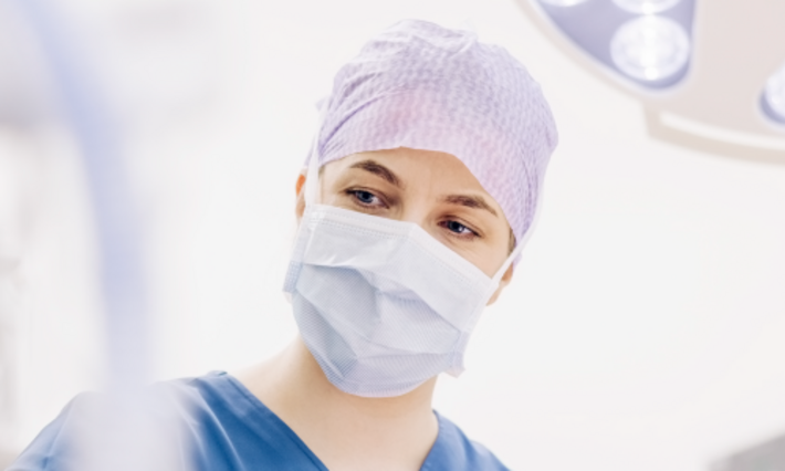 Female surgeon during surgery in operating room