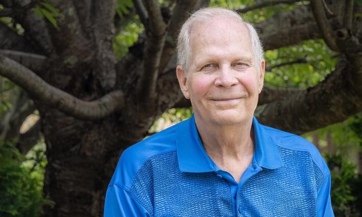 Ned Steele stands in the front yard of his Greensboro, NC home. Steele is being treated at Duke for metastatic prostate cancer.