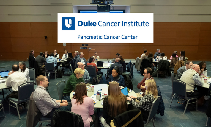 Duke Cancer Institute Pancreatic Cancer Center logo over photo of attendees at an event