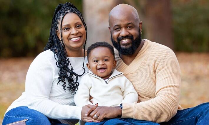 Arlene Brown smiles for a family photo with her husband, Richard, and their son Andrew. Photo courtesy of Faith V Photography