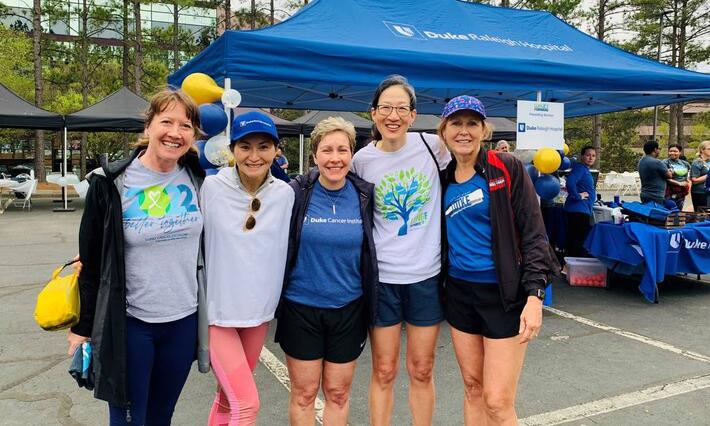 DCI team members smile together at the 2023 Triangle Lunge Forward event