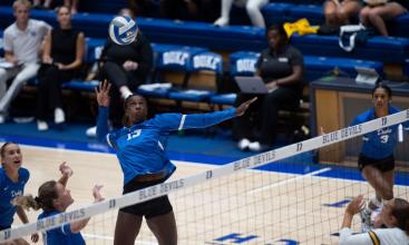 Duke Volleyball player gets ready to spike the ball at a game vs. West Virginia