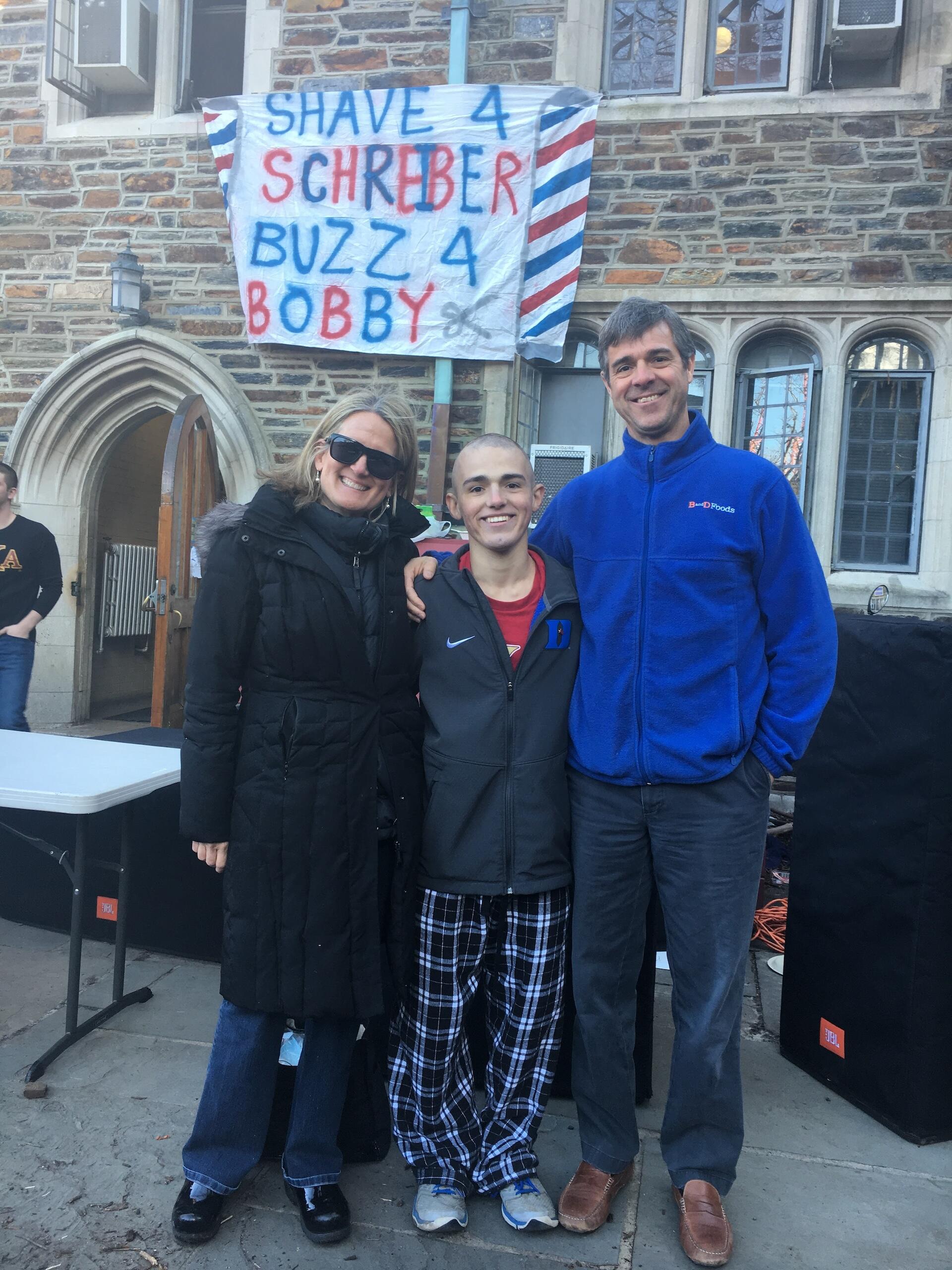 Liz, Bobby, and Peter Menges at Duke Shave & Buzz, an annual fundraising event that Bobby co-founded.