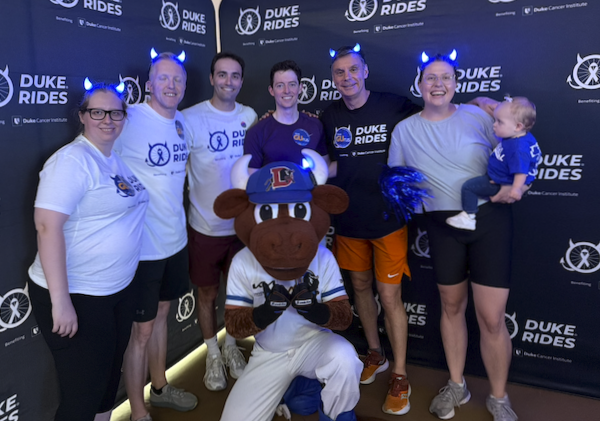 Prostate and Urologic Cancer Team posts in front of Duke Rides logo