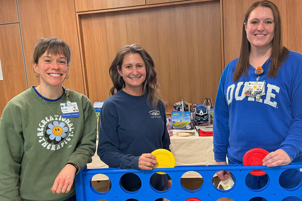 Tiffany Atkinson, Hannah Burke, and Nancy Austin enjoy Connect Four