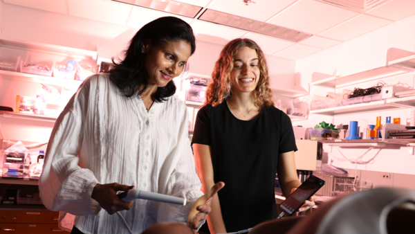 Duke biomedical engineer Nimmi Ramanujam, PhD, (left) works on developing the Pocket Colposcope with post-baccalaureate fellow Maia Raynor.