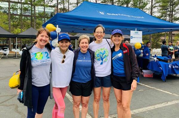 DCI team members smile together at the 2023 Triangle Lunge Forward event