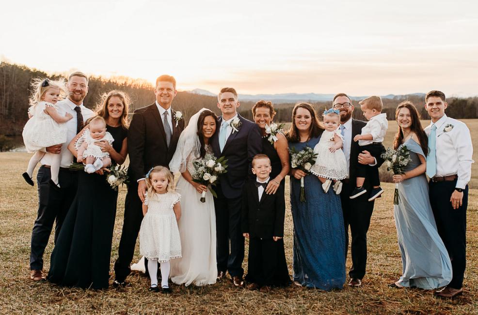 Janel (to the right of the groom) and Troy Keaton (to the left of the bride) gathered with their family for their son TJ’s wedding