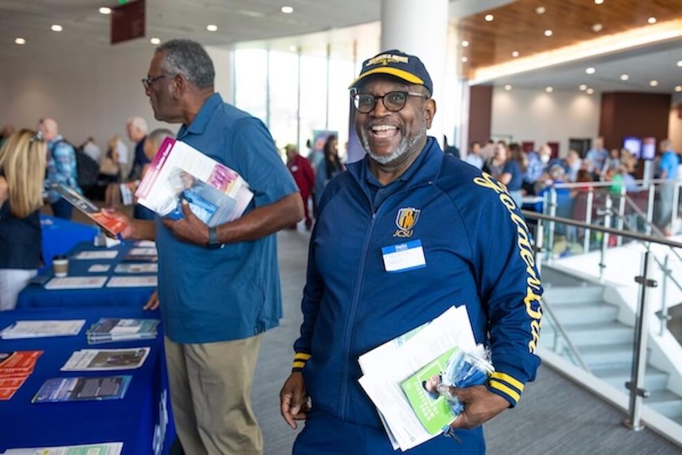 Man smiling at Genitourinary Cancers Community Education Event