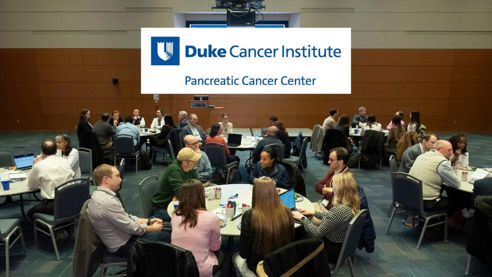 Duke Cancer Institute Pancreatic Cancer Center logo over photo of attendees at an event