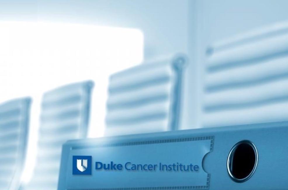 Duke Cancer Institute-labeled light blue binder