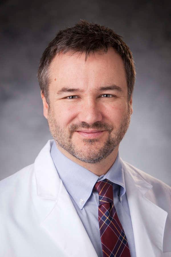 James Davis, MD in white doctor coat