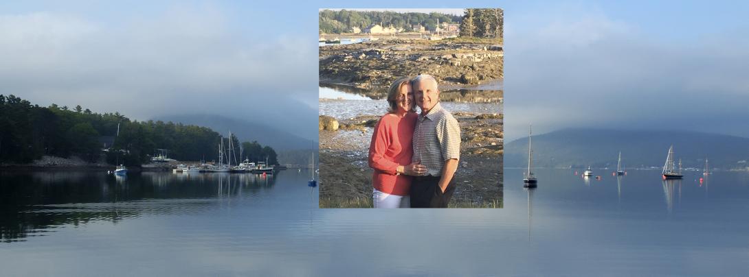 An inset photo of Donald McDonnell and his wife Mary on a rocky shore in Maine. The picture behind the inset is a calm bay in Maine.