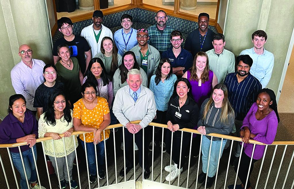 Group photo of Donald McDonnell lab members standing on a balcony