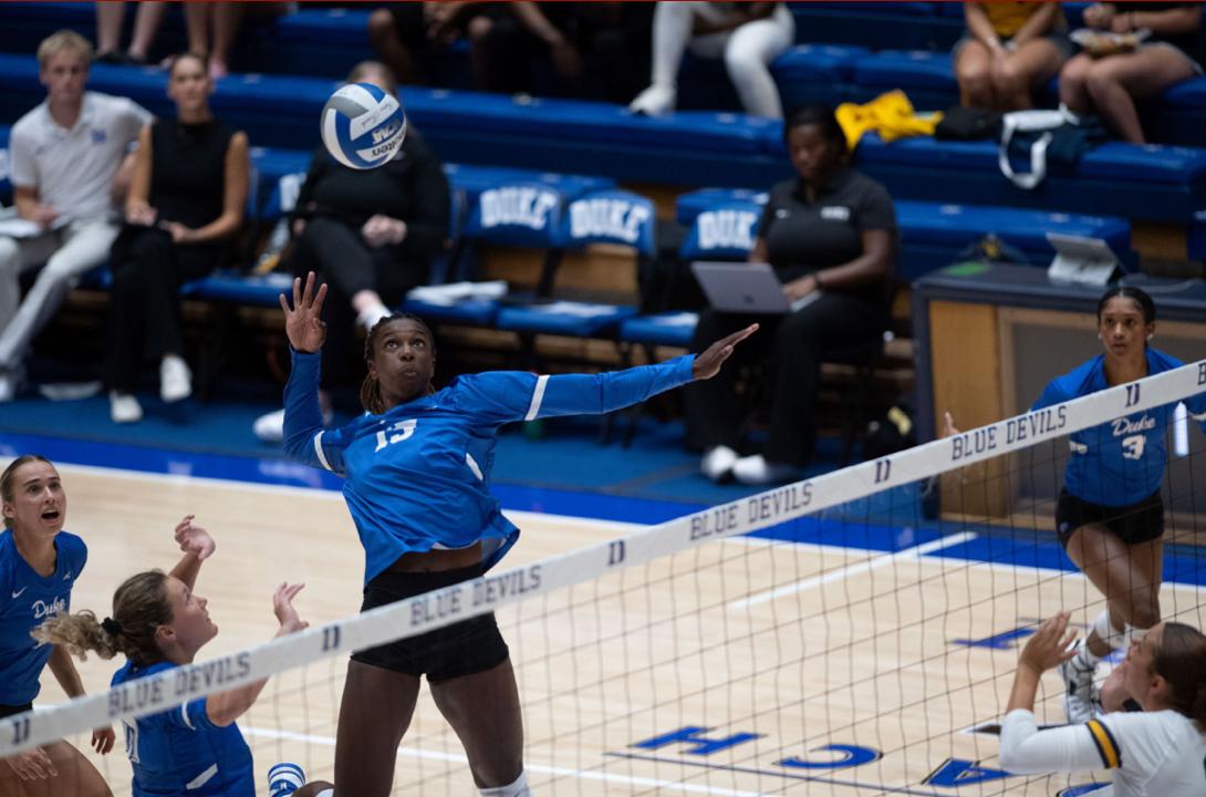 Duke Volleyball player gets ready to spike the ball at a game vs. West Virginia