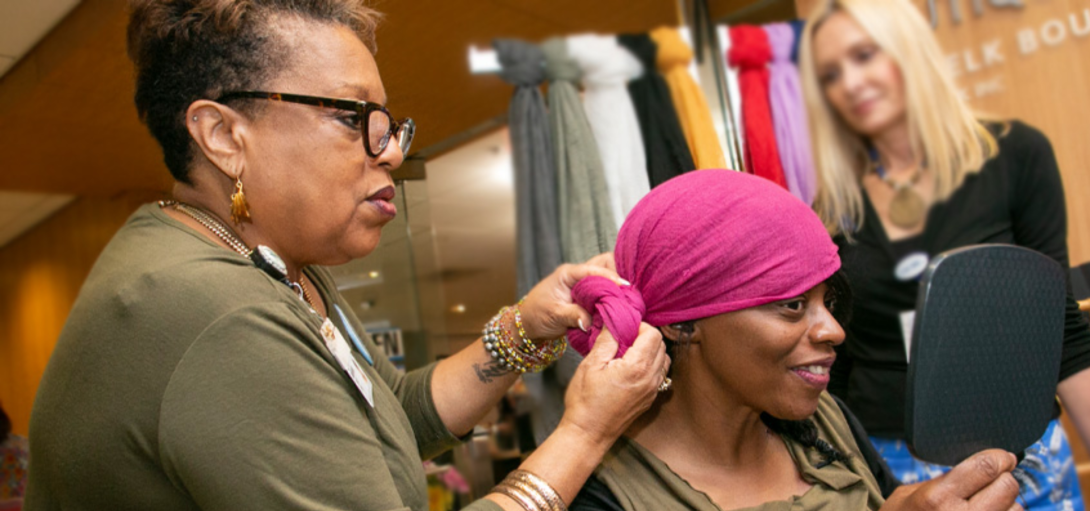 Supportive Care and Survivorship Members style headscarf on patient